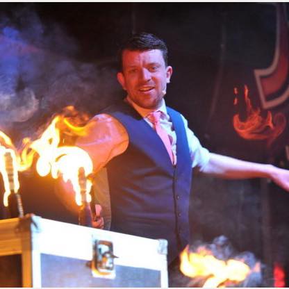 JezO performing an illusion with fire